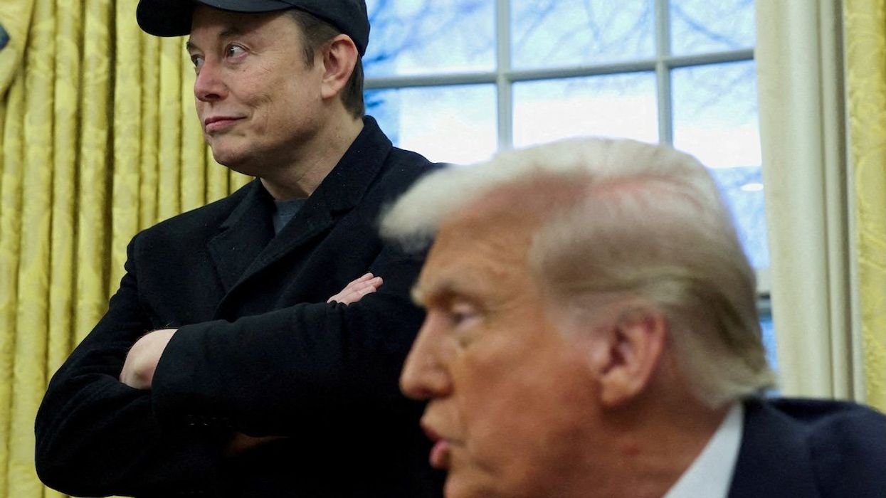 Elon Musk listens as President Donald Trump speaks in the Oval Office of the White House in Washington, DC, on Feb. 11, 2025.