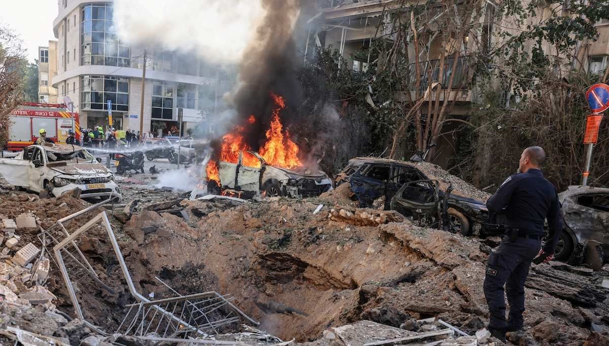 ​Emergency personnel respond at a site following Iranian missile barrages in central Israel, amid the U.S.-Israel conflict with Iran, in Tel Aviv, Israel, March 24, 2026.