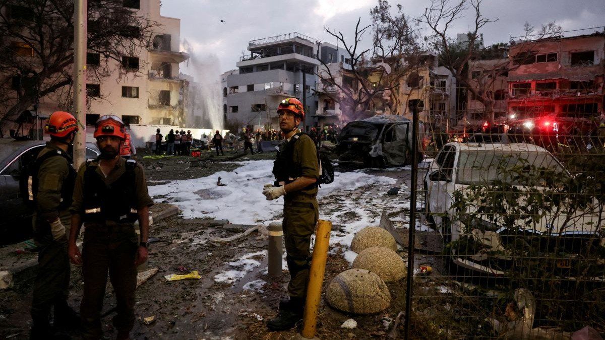 ​Emergency personnel work at an impact site following a missile attack from Iran on Israel, in Tel Aviv, Israel, on June 16, 2025.