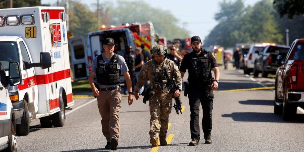 ​Emergency personnel work at the scene of a shooting which took place at the Church of Jesus Christ of Latter-day Saints, according to police, in Grand Blanc, Michigan, U.S., September 28, 2025. 