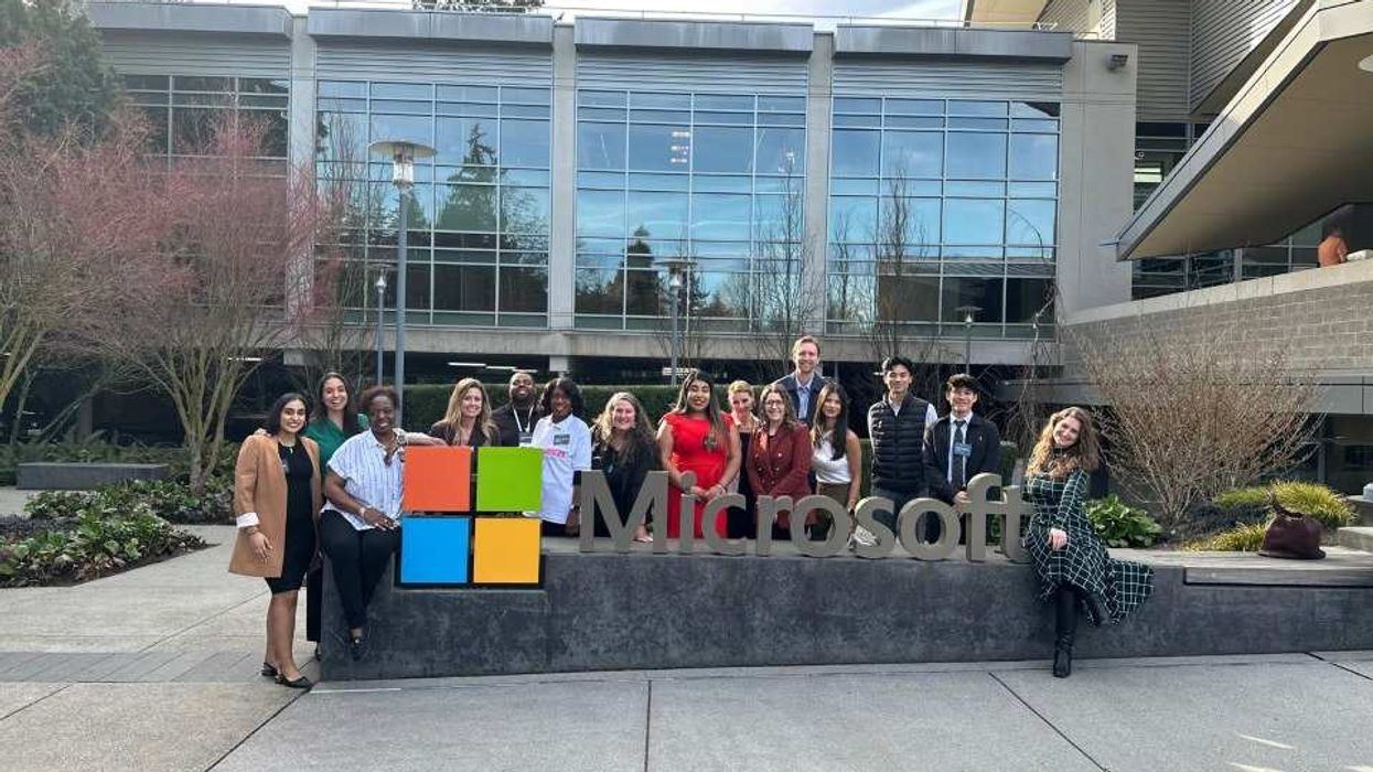 Employees in front of a Microsoft office