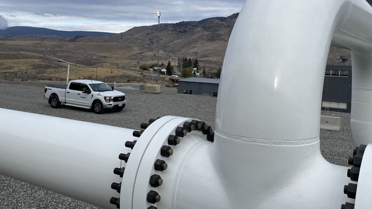 Energy pipe with a car in the background