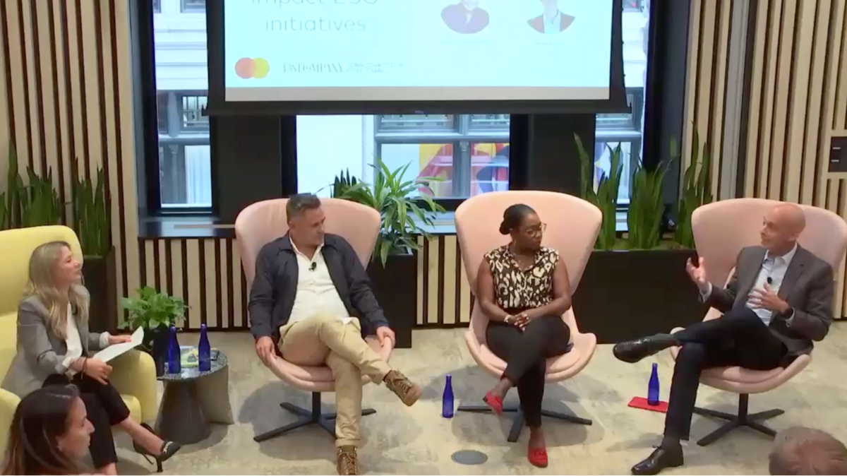 Entrepreneurs sitting in chairs talking.