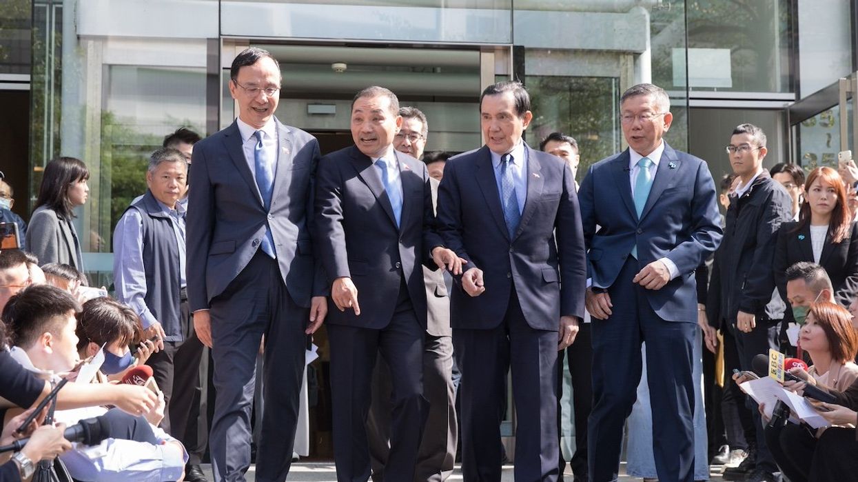 Eric Chu, Taiwan’s main opposition Kuomintang (KMT) chairman, Hou Yu-ih, KMT presidential candidate, Ma Ying-jeou, former Taiwan president and Ke Wen-je, presidential candidate from the Taiwan People’s Party (TPP) pose after thier meeting on November 15, 2023.