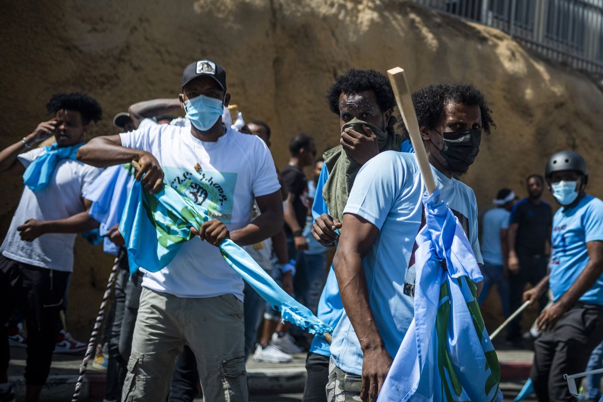 ​Eritrean asylum seekers clash with police during a demonstration in Tel Aviv.