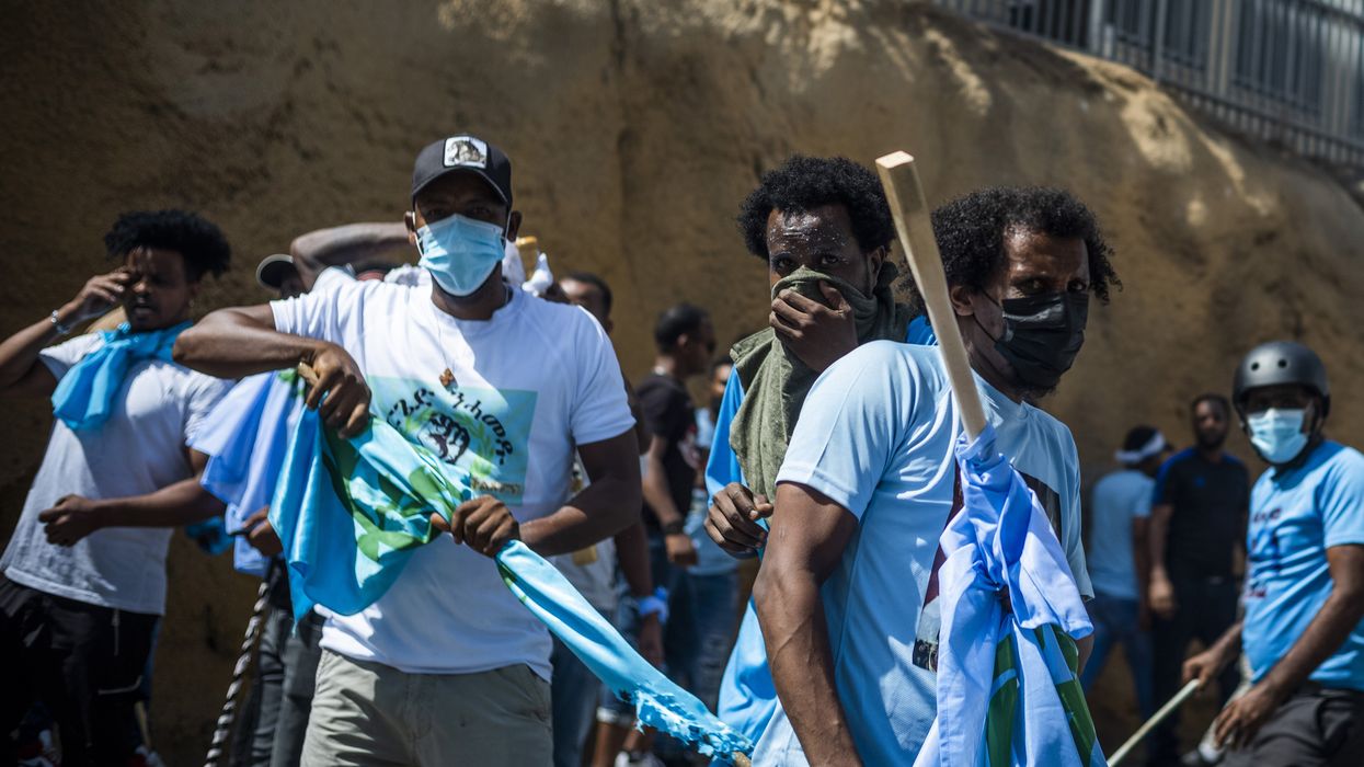 Eritrean asylum seekers clash with police during a demonstration in Tel Aviv.