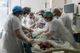 Doctor and medical colleagues treat a patient suffering from COVID-19 in the Intensive Care Unit (ICU) at the Robert Ballanger hospital near Paris during the outbreak of the coronavirus disease in France, October 26, 2020