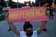 A pro-independence protester holds a placard that reads: "Independence. There's another way to live", during a demonstration on Catalonia's day of 'La Diada' in Barcelona, Spain, September 11, 2020
