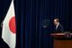 apan's Prime Minister Yoshihide Suga bows in front of the national flag at a news conference after the government's decision to exted a state of emergency amid coronavirus disease (COVID-19) pandemic, at the prime minister's official residence in Tokyo, Japan May 28, 2021