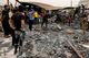 eople gather as they inspect the damage at al-Hussain coronavirus hospital where a fire broke out, in Nassiriya, Iraq, July 13, 2021.
