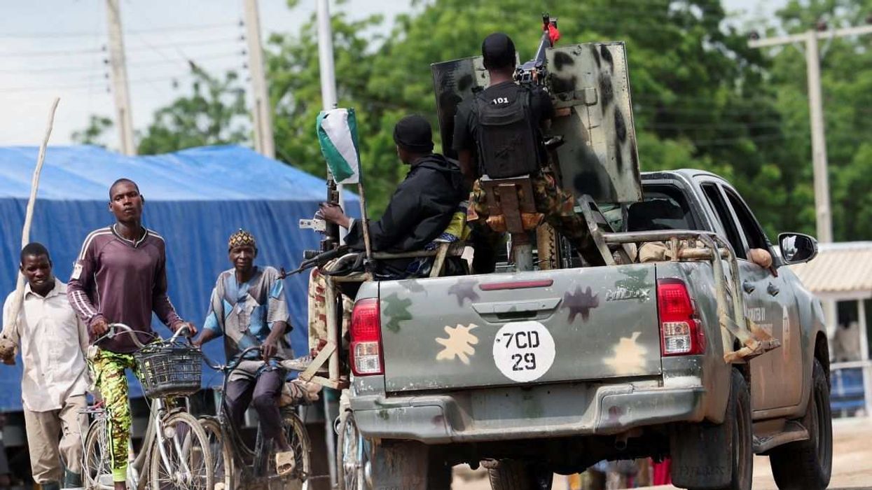 Farmers proceed to their fields for cultivation under Nigerian Army escort while departing Dikwa town in Borno State, Nigeria, on August 27, 2025.
