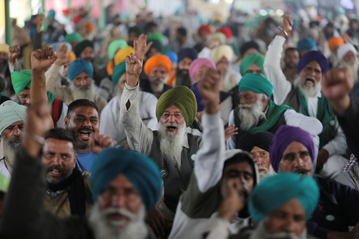 Farmers shout slogans as they attend ongoing speeches at the Singhu border protest site near the Delhi-Haryana border, India, December 9, 2021.