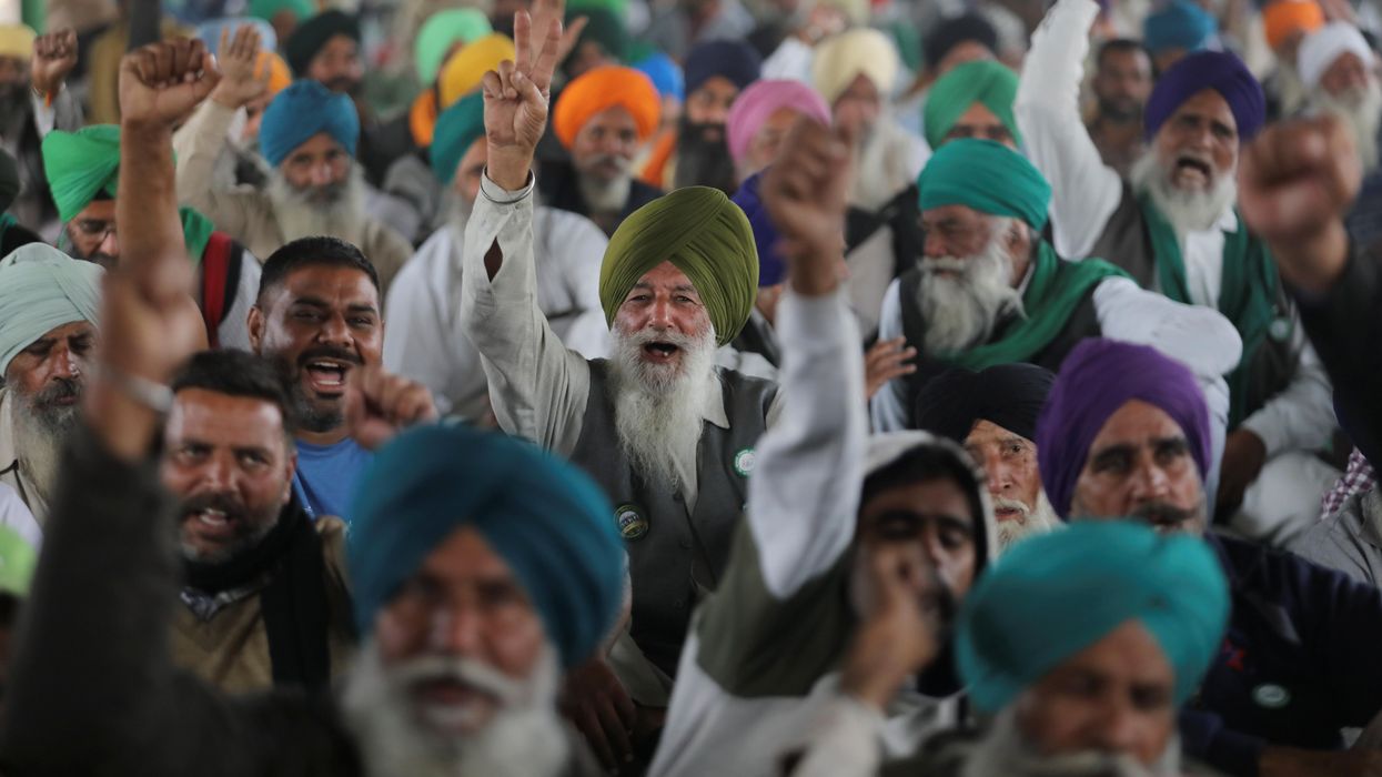 Farmers shout slogans as they attend ongoing speeches at the Singhu border protest site near the Delhi-Haryana border, India, December 9, 2021.