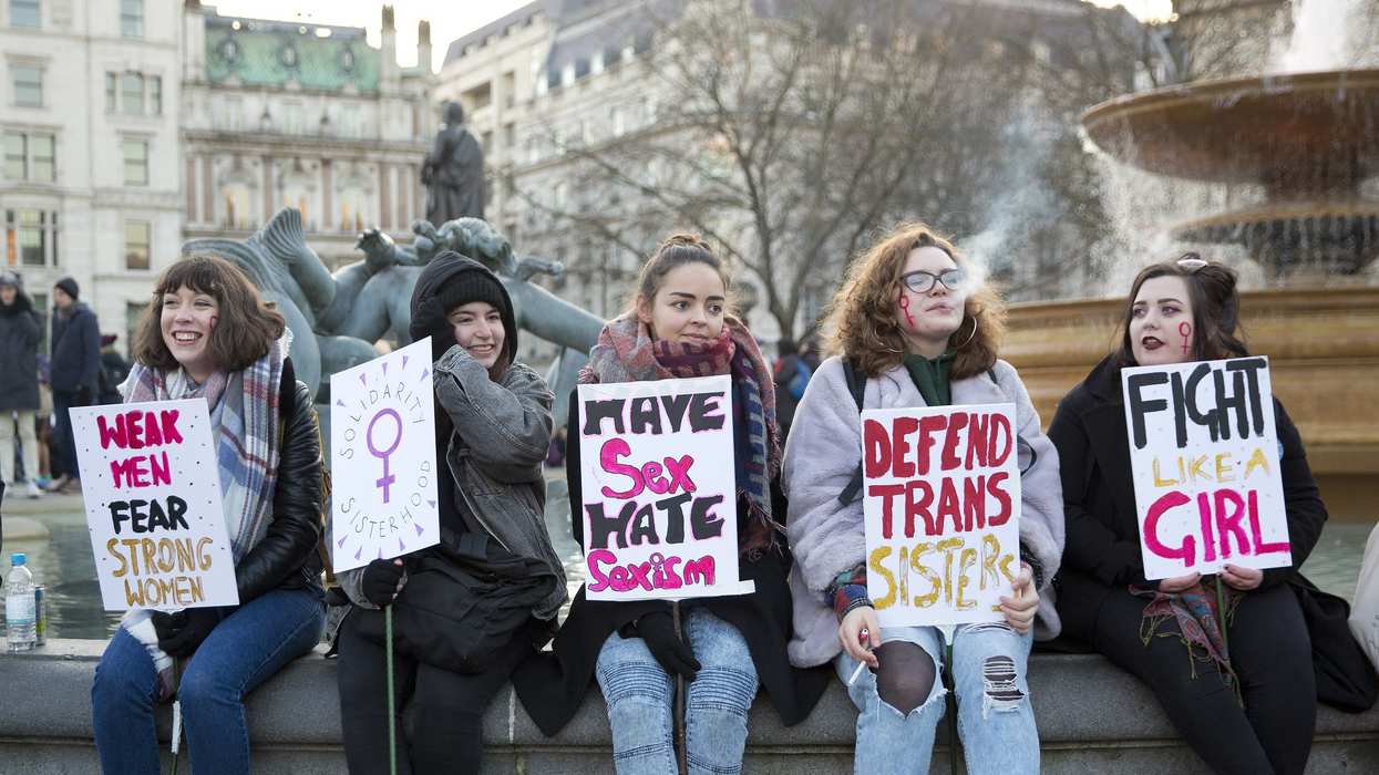 Feminist protestors holding signs on International Women's Day.