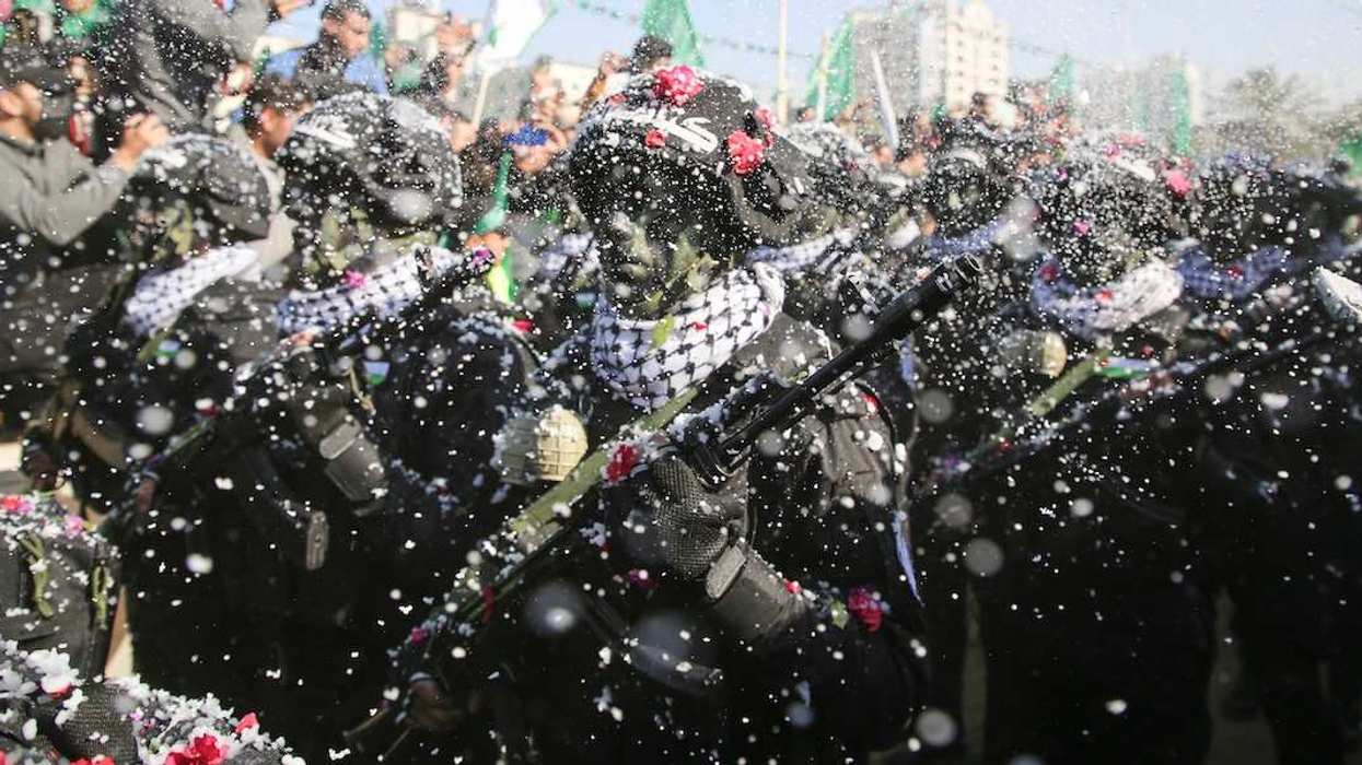 Fighters of the Qassam Brigades, the armed wing of the Palestinian Islamist Hamas movement, attend a rally marking the 35th anniversary of the group's foundation in Gaza City on December 14, 2022.