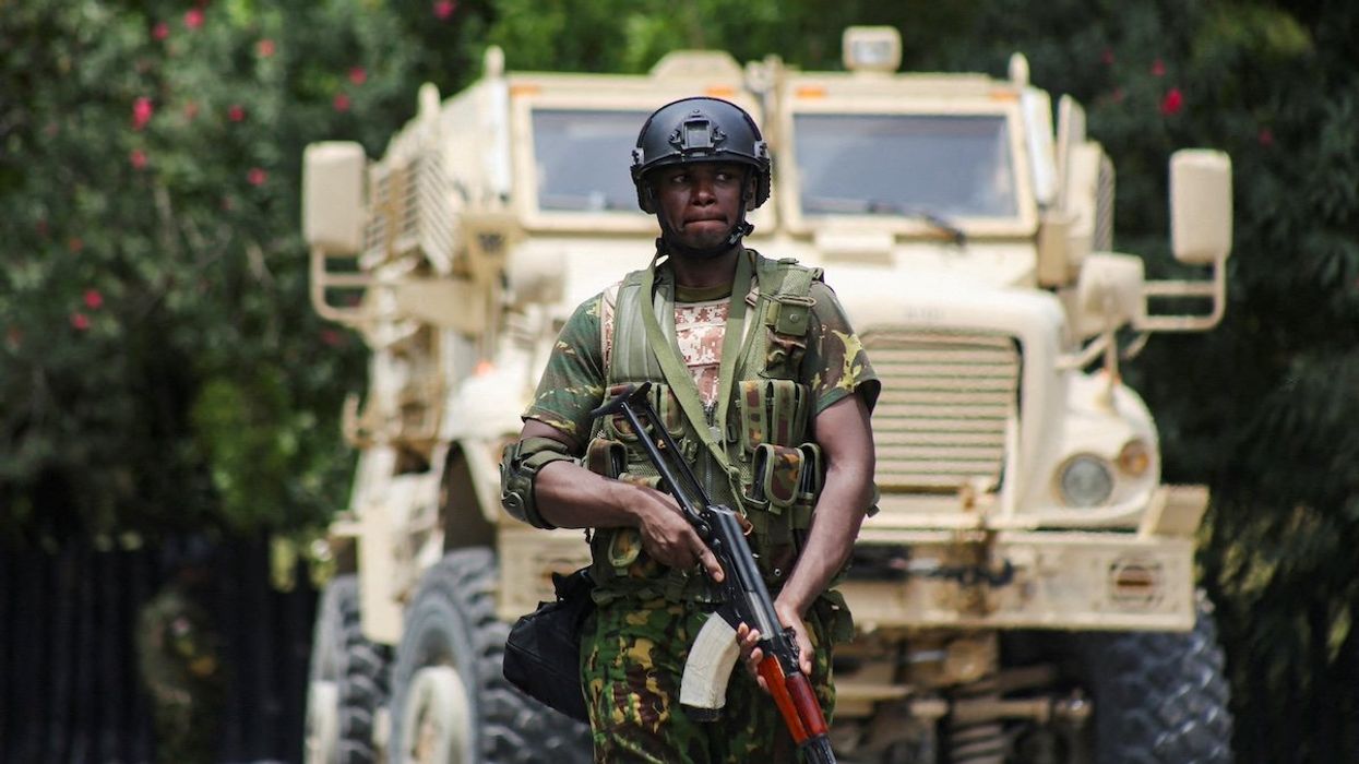 FILE PHOTO: A Kenyan police officer walks in front of an armoured personnel carrier during a joint operation with Haitian police, in Port-au-Prince, Haiti July 29, 2024.