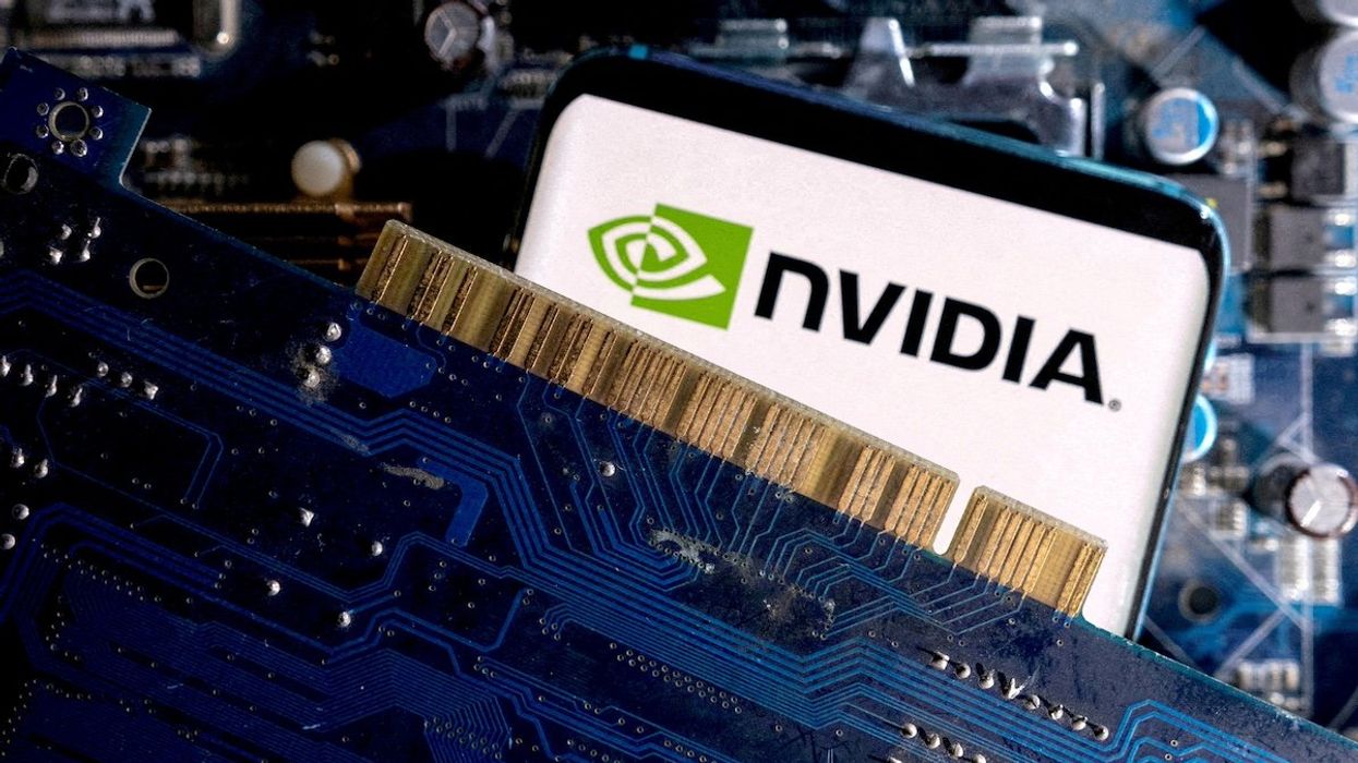 FILE PHOTO: A smartphone with a displayed NVIDIA logo is placed on a computer motherboard in this illustration taken March 6, 2023.