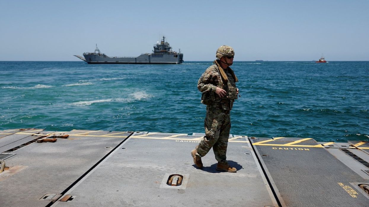 FILE PHOTO: A soldier stands at Trident Pier, a temporary pier to deliver aid, off the Gaza Strip, amid the ongoing conflict between Israel and Hamas, near the Gaza coast, June 25, 2024.