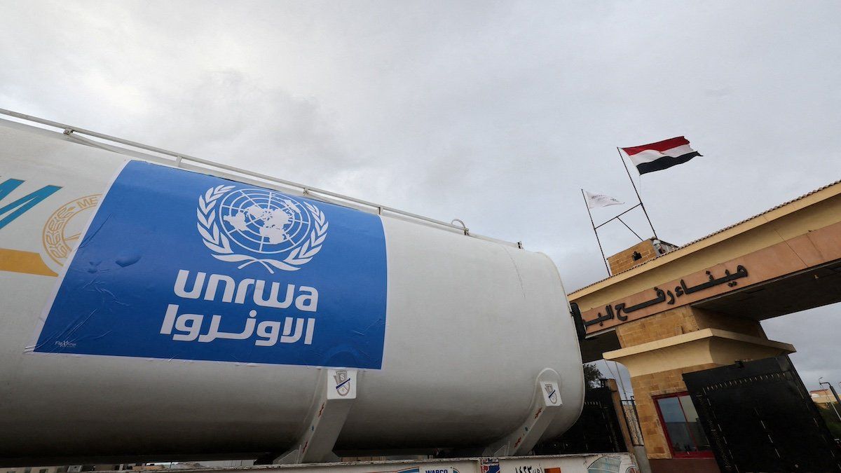 ​FILE PHOTO: A truck, marked with United Nations Relief and Works Agency (UNRWA) logo, crosses into Egypt from Gaza, at the Rafah border crossing between Egypt and the Gaza Strip, during a temporary truce between Hamas and Israel, in Rafah, Egypt, November 27, 2023. 
