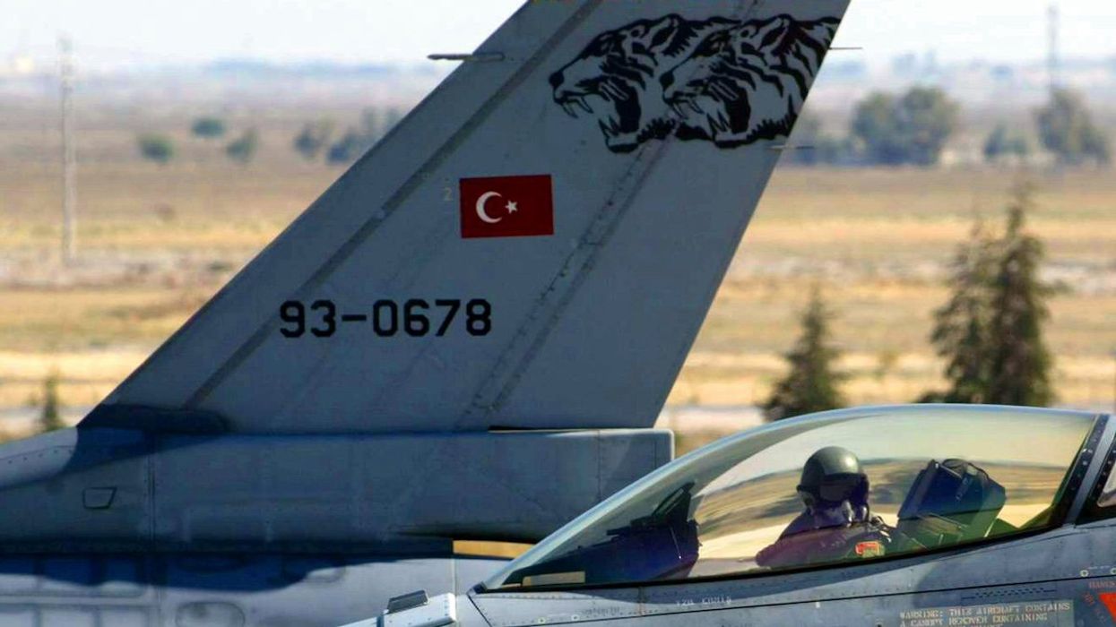 FILE PHOTO: A Turkish F-16 pilot taxis past another Turkish Air Force F-16 at the 3rd Main Jet Air Base in central Turkey's city of Konya.