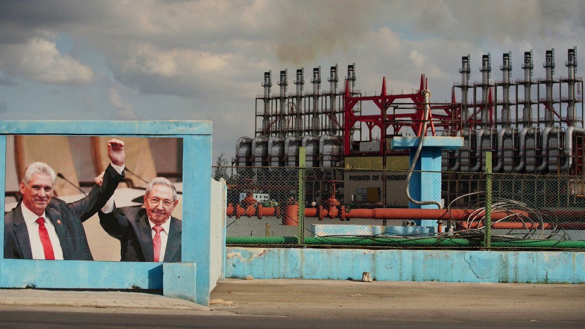 FILE PHOTO: An image of Cuba's former President Raul Castro and Cuba's President and First Secretary of the Communist Party Miguel Diaz-Canel is seen beside a Turkish powership, in Havana, Cuba, April 17, 2023. 