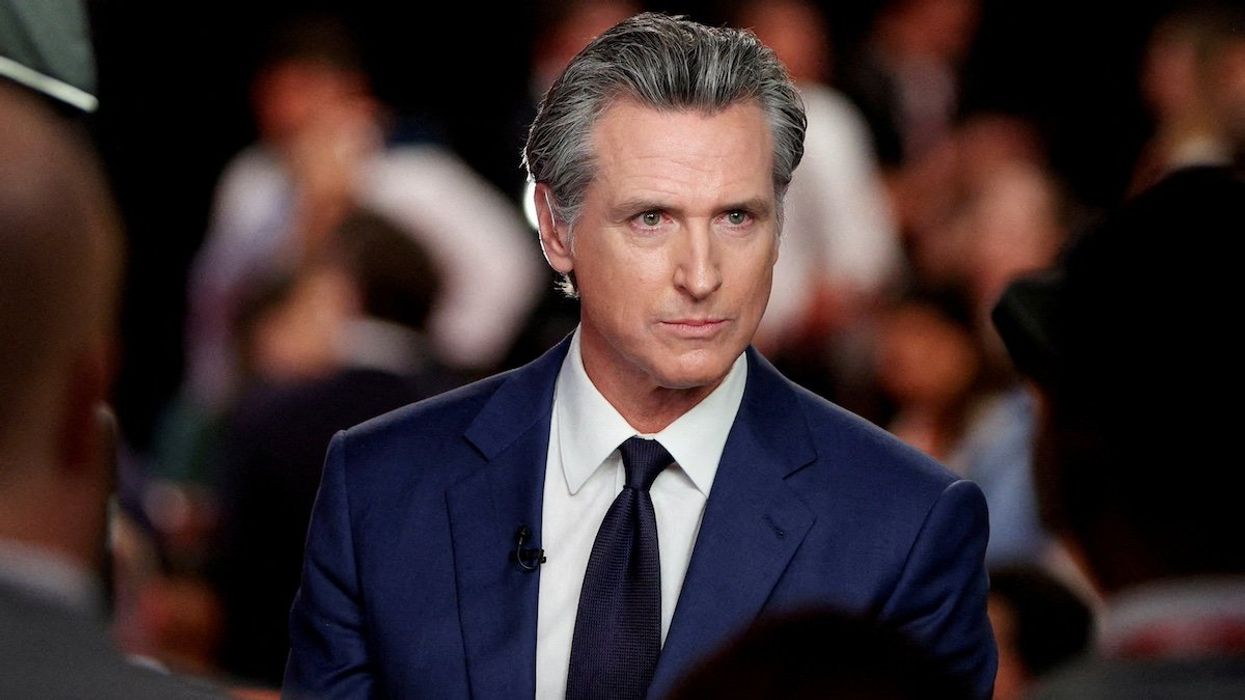 FILE PHOTO: California Governor Gavin Newsom (D) reacts as he speaks to the members of the press on the day of the first presidential debate hosted by CNN in Atlanta, Georgia, U.S., June 27, 2024.