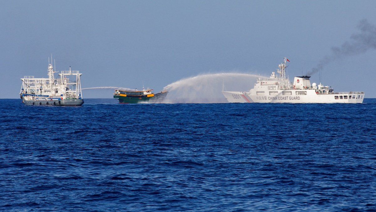 ​FILE PHOTO: Chinese Coast Guard vessels fire water cannons towards a Philippine resupply vessel Unaizah May 4 on its way to a resupply mission at Second Thomas Shoal in the South China Sea, March 5, 2024. 