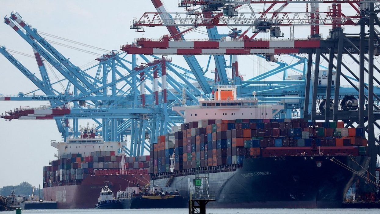 FILE PHOTO: Docked cargo ships are loaded with shipping containers at Port Elizabeth, New Jersey, U.S., July 12, 2023.
