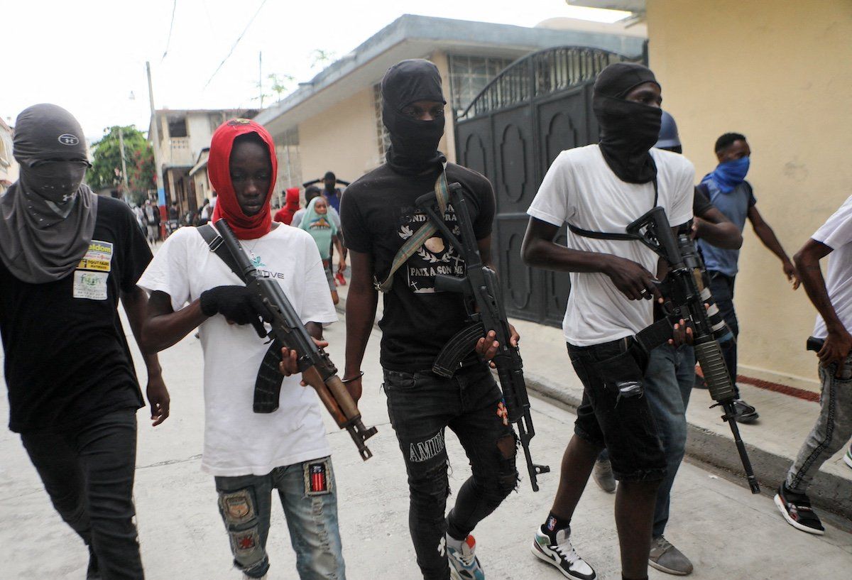 FILE PHOTO: Former police officer Jimmy "Barbecue" Cherizier (not pictured), leader of the 'G9' coalition, is accompanied by Security during a march against Haiti's Prime Minister Ariel Henry, in Port-au-Prince, Haiti September 19, 2023. 