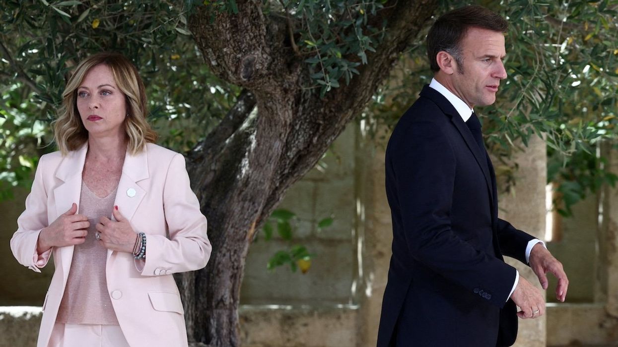 FILE PHOTO: French President Emmanuel Macron walks next to Italy's Prime Minister Giorgia Meloni on the first day of the G7 summit, at the Borgo Egnazia resort, in Savelletri, Italy June 13, 2024.