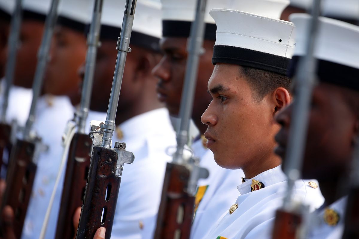 FILE PHOTO: Guyanese Military members line up before Britain's Prince Harry laughs arrives for an official visit of Georgetown, Guyana December 2, 2016.