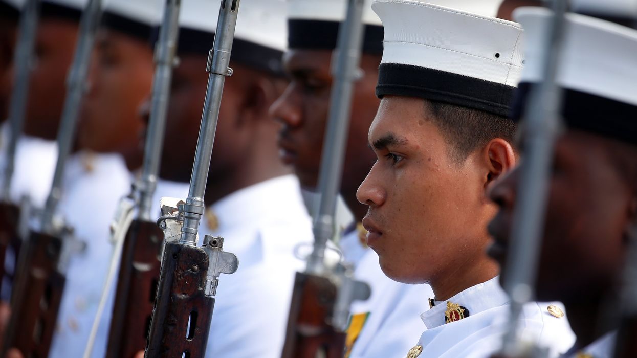 FILE PHOTO: Guyanese Military members line up before Britain's Prince Harry laughs arrives for an official visit of Georgetown, Guyana December 2, 2016.
