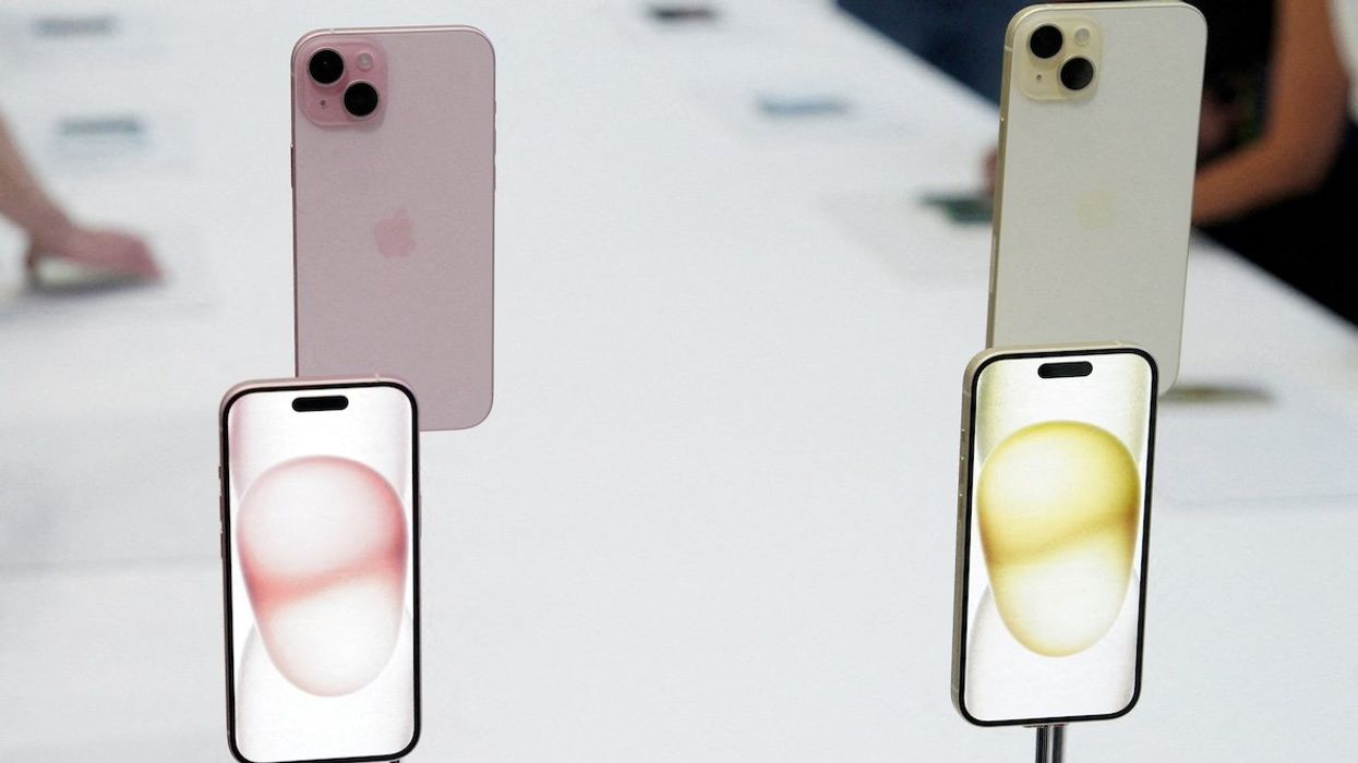 FILE PHOTO: iPhone 15 and iPhone 15 Plus are displayed during the 'Wonderlust' event at the company's headquarters in Cupertino, California, U.S. September 12, 2023.