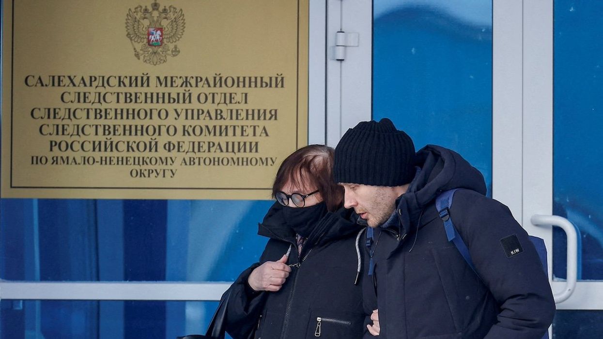 FILE PHOTO: Lyudmila Navalnaya, the mother of late Russian opposition leader Alexei Navalny, and his lawyer Alexei Tsvetkov walk out of an office of the Investigative Committee's regional department in the city of Salekhard in the Yamal-Nenets Region, Russia, February 19, 2024.