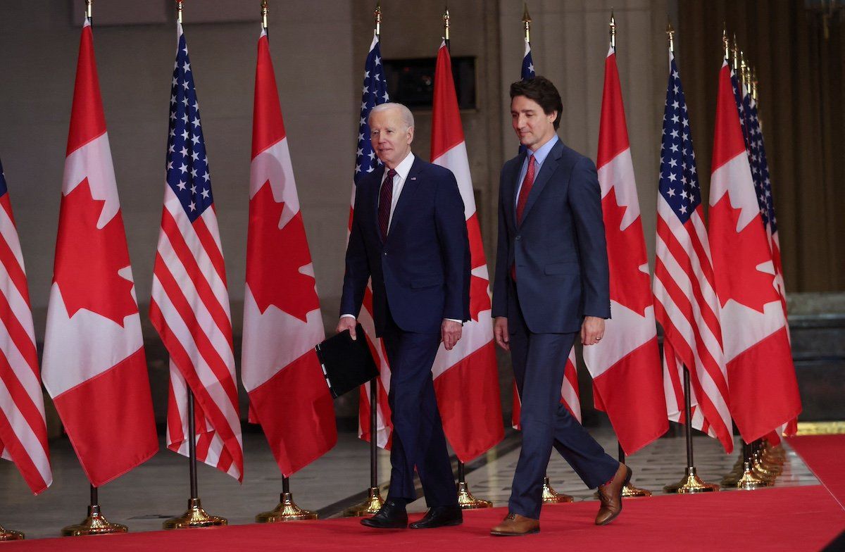 FILE PHOTO: On the surface, Joe Biden and Justin Trudeau had similar Christmas holidays. 