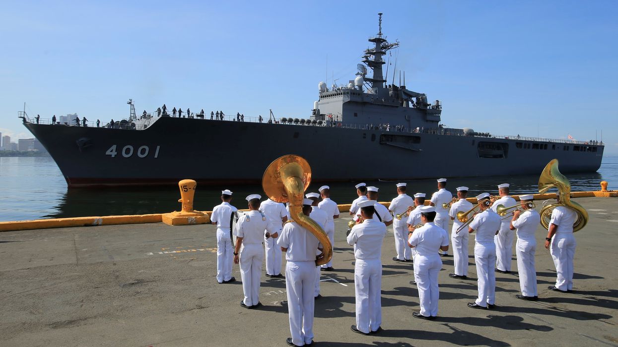 FILE PHOTO: Philippine Navy welcomes the arrival of Japanese Maritime Self-Defence Force ship for a two-day goodwill visit upon its arrival at the South Harbor in Metro Manila, Philippines April 26, 2018.
