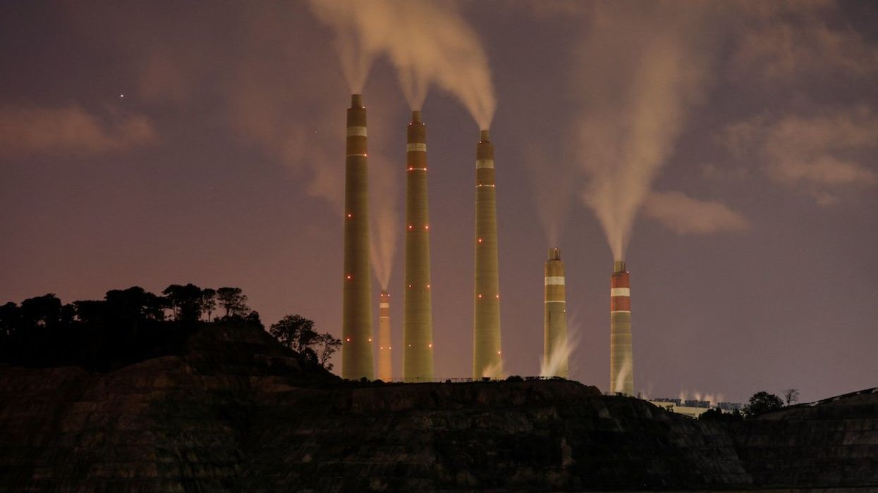 FILE PHOTO: Smoke and steam billows from the coal-fired power plant owned by Indonesia Power, next to an area for Java 9 and 10 Coal-Fired Steam Power Plant Project in Suralaya, Banten province, Indonesia, July 11, 2020.