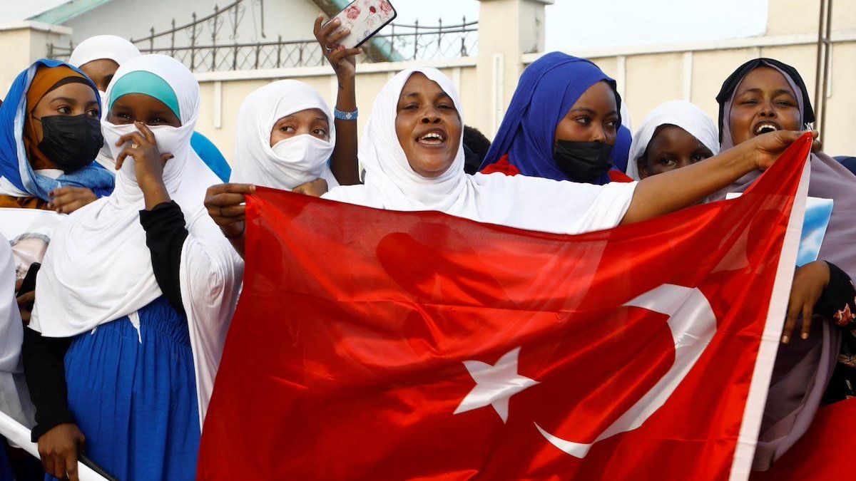 ​FILE PHOTO: Somali supporters of Turkish President Tayyip Erdogan hold Turkey's flag during celebrations after the second round of the presidential election, in Mogadishu, Somalia May 29, 2023. 