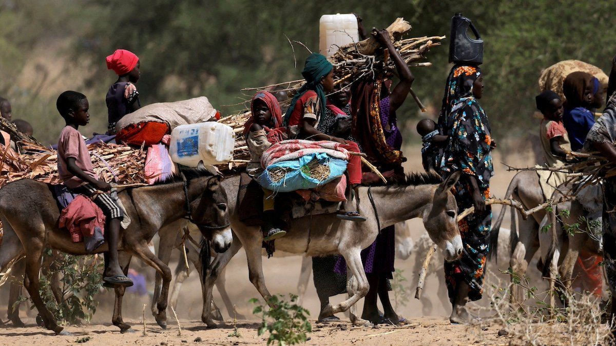 FILE PHOTO: Sudanese refugees who fled the violence in Sudan's Darfur region and newly arrived ride their donkeys looking for space to temporarily settle, near the border between Sudan and Chad in Goungour, Chad May 8, 2023. 