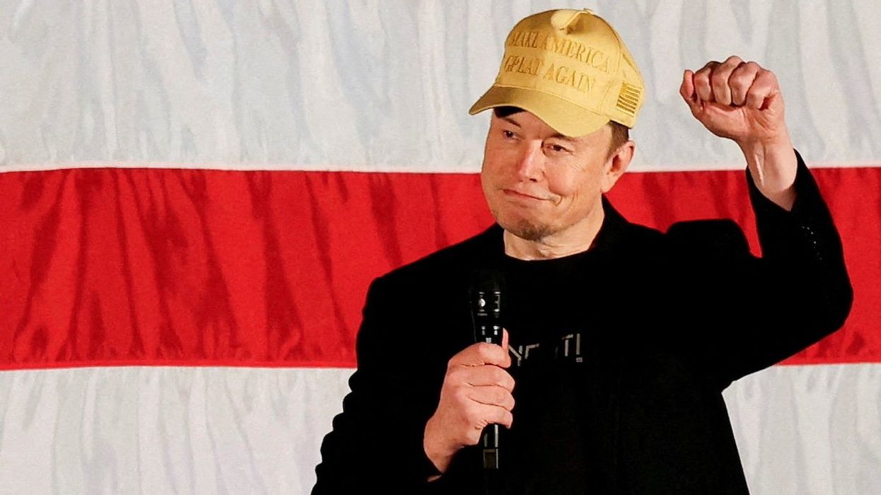 FILE PHOTO: Tesla CEO and X owner Elon Musk, who supports Republican presidential nominee former U.S. President Donald Trump, gestures as he speaks about voting during an America PAC Town Hall in Folsom, Pennsylvania, U.S., October 17, 2024.