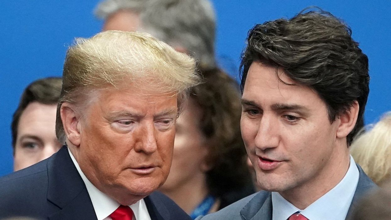 FILE PHOTO: U.S. President Donald Trump talks with Canada's Prime Minister Justin Trudeau during a North Atlantic Treaty Organization Plenary Session at the NATO summit in Watford, Britain, December 4, 2019.