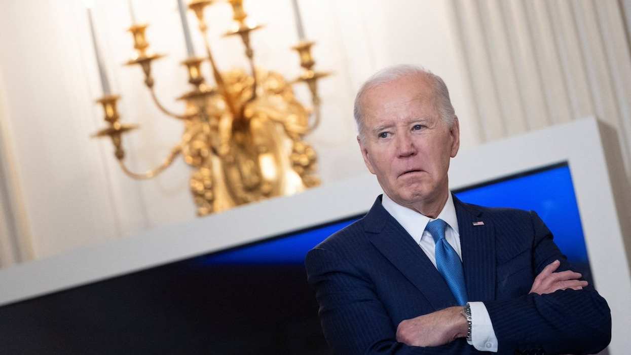 FILE PHOTO: U.S. President Joe Biden looks on before speaking during a roundtable discussion on public safety at the State Dining Room at the White House in Washington, U.S., February 28, 2024.