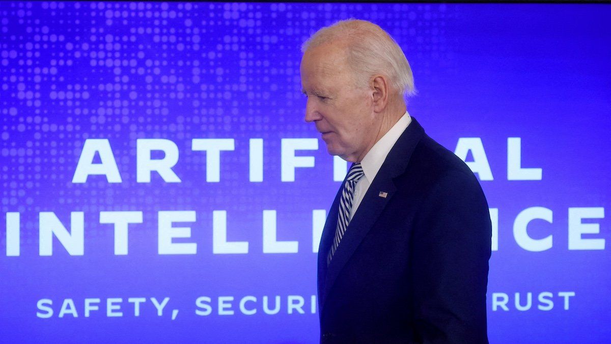 FILE PHOTO: U.S. President Joe Biden walks across the stage to sign an Executive Order about Artificial Intelligence in the East Room at the White House in Washington, U.S., October 30, 2023.