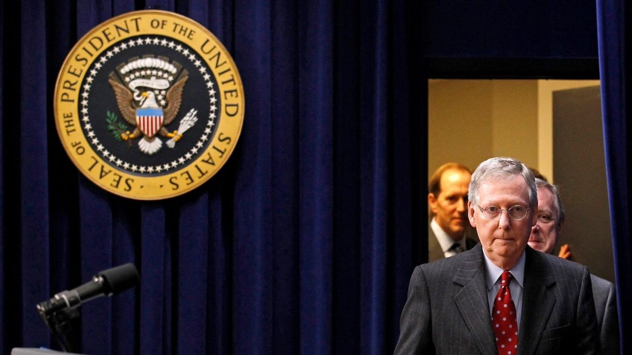 FILE PHOTO: U.S. Senate Republican leader Mitch McConnell (R-KY) arrives for the signing into law a bill at the Eisenhower Executive Office Building in Washington, December 17, 2010.