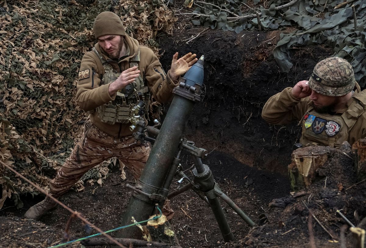 ​FILE PHOTO: Ukrainian servicemen of the 28th Separate Mechanized Brigade fire a 120-mm mortar towards Russian troops at a frontline, amid Russia's attack on Ukraine, near the town of Bakhmut, Ukraine March 15, 2024. 