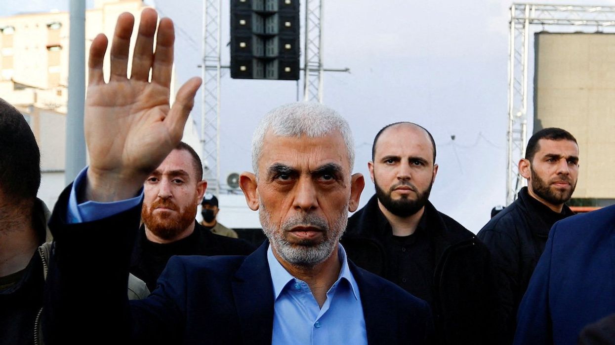 FILE PHOTO: Yahya Sinwar, Gaza Strip chief of the Palestinian Islamist Hamas movement, waves to Palestinians during a rally to mark the annual al-Quds Day (Jerusalem Day), in Gaza, April 14, 2023.