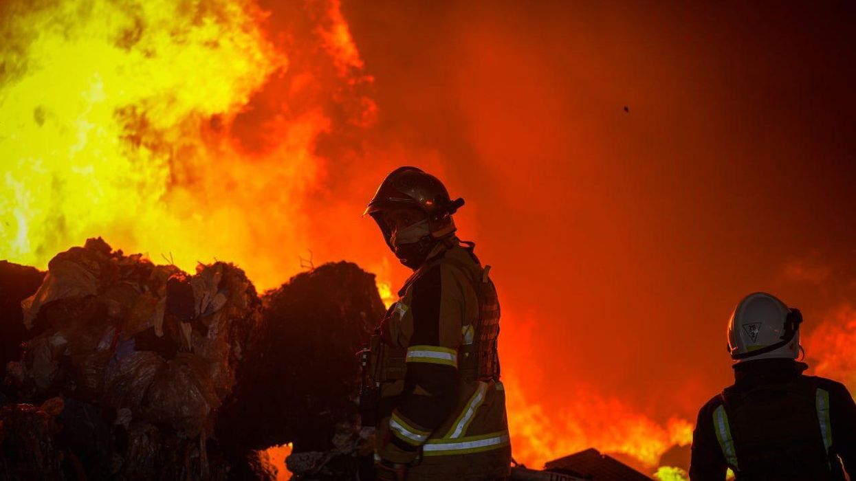 Firefighters at the site of a Russian missile attack in Zaporizhzhia, Ukraine.