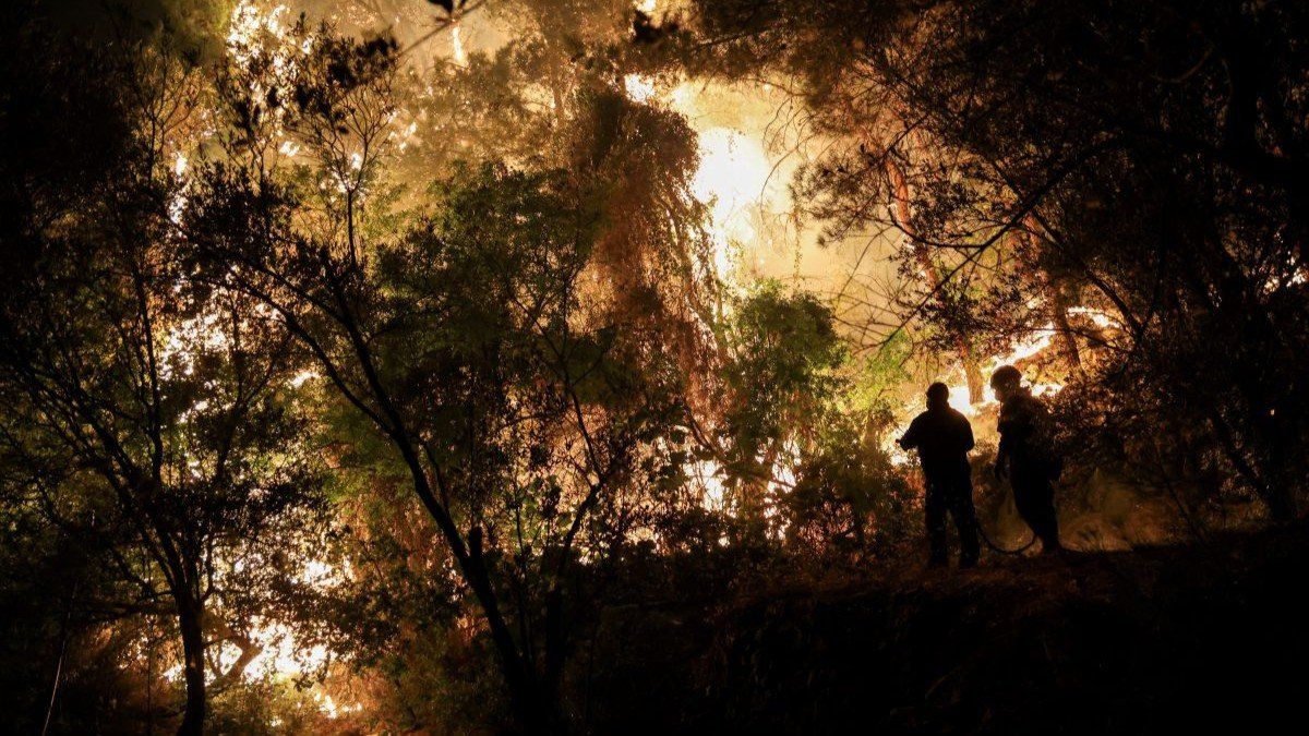 Firefighters try to tackle a wildfire burning on Chios island, Greece, June 23, 2025.
