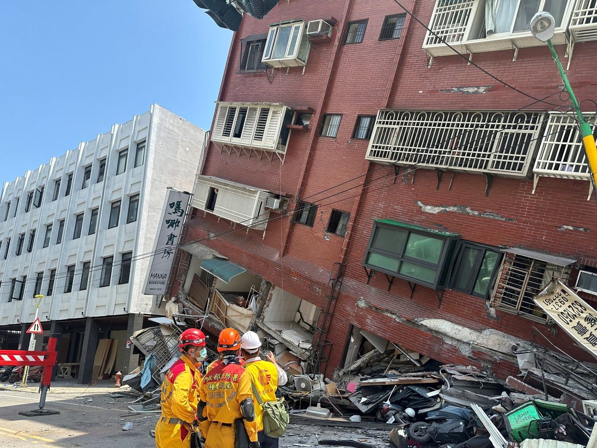 ​Firefighters work at the site where a building collapsed following the earthquake, in Hualien, Taiwan, in this handout provided by Taiwan's National Fire Agency on April 3, 2024.  