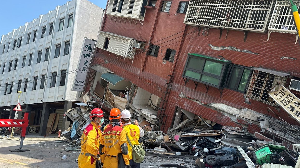 Firefighters work at the site where a building collapsed following the earthquake, in Hualien, Taiwan, in this handout provided by Taiwan's National Fire Agency on April 3, 2024.